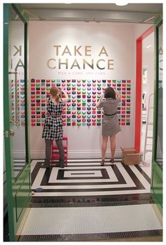 two women standing in front of a window with the words take a chance on it