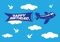 an airplane with a banner that says happy birthday flying in the sky and birds around it