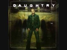 a man standing in front of a group of people wearing green suits and ties with the words daughtry on it