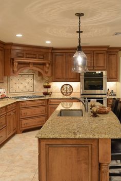 a kitchen with wooden cabinets and granite counter tops