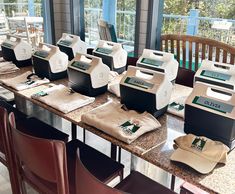 there are many different types of machines on the table in front of some chairs and tables