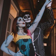 a man and woman dressed up as jack skellingy and the corpse from beetlejuice