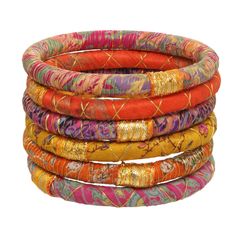 WHEN YOU WANT TO TELL A STORY WHAT IT IS: Upcycled sari fabrics make a statement in these beautiful bangles wrapped in a gold accent. Named for the Sanskrit word for "girl". WHY IT’S SPECIAL: These bangles were handmade for Rosena Sammi by women rescued from sex trafficking in India Every piece is unique—colors and patterns of the upcycled fabrics will vary GOOD TO KNOW: Sold as a set of 6Diameter: 2.5" Due to their handmade nature, each piece is unique Bright: Set can incorporate a range of colors including orange, red, yellow, purple, pink and multi-colors all in shades of light and dark. Blues/Greens: Set can incorporate a range of shades in the blue and green family, including aqua, turquoise, navy, olive, lime, green-yellow and multi-colors all in shades of light and dark. Neutral: Se Fabric Bangles, Beautiful Bangles, Wrap Bangles, Fibres Textiles, Sari Fabric, Alcohol Inks, Charm Bangle, Gold Accent, Bangle Set