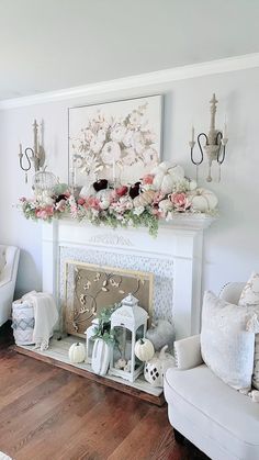 a living room filled with furniture and a fire place in front of a painting on the wall