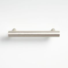 a stainless steel door handle on a white wall