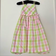 Cute Dress With Plaid Design. Has Tulle Skirt And Bows With Flowers On The Front. The Back Buttons Up. Pink Cotton Dress For Dress-up, Pink Cotton Dress For Dress-up Occasions, Pink Cotton Sundress For Dress-up, Pink Sleeveless Sundress For Dress-up, Green Polka Dot Dress, Jean Dresses, Red Plaid Dress, Girls Sundress, Girls White Dress