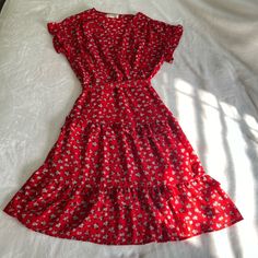 Cute Ruffle Floral Sundress From Monteau In The Color Red With White Flower Pattern Throughout. Knee Length With Dolman Sleeves And Tied At The Waist. Size: Women’s S. Brand New, Unworn, But Missing Original Price Tag. Red Floral V-neck Dress For Brunch, Red V-neck Floral Dress For Brunch, Red Short Sleeve Floral Beach Dress, Red Floral Print Tiered Dress, Red Short Sleeve Floral Dress For Beach, Red Casual Floral Dress With Short Sleeves, Red Tiered Floral Print Dress, Red Short Sleeve Dress With Ruffle Hem, Red Ditsy Floral Print Dress For Brunch