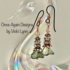 “Morning Dew” - Dangle Earrings Hand Created - Once Again Designs By Vicki Lynn Limited Edition Delicate Earrings Feature Czech Glass Flower Beads With An Iridescent Finish. The Flower Beads Are Paired With Crystal Rondelles, Crystal Glass Beads, And Ornate Copper Plated Bead Caps. The Combination Give These Earrings A Dewy Morning Fairy Woodland Vibe. This Pair: - Czech Glass Flower Beads, - Crystal Glass Beads. - Ornate Tierracast Copper Coated Bead Caps. - Tierracast Niobium Hypoallergenic Fr Czech Glass Jewelry Artbeads.com, Glass Crystal Earrings, Dewy Morning, Czech Beads Jewelry, Fairy Woodland, Jewelry 2024, Earring Inspo, Czech Glass Jewelry, Beaded Earring