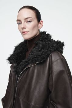 SHEARLING-LINED NAPPA HOODED JACKET Sheepskin Hooded Outerwear With Faux Fur Trim, Hooded Sheepskin Outerwear With Faux Fur Trim, Hooded Outerwear With Faux Fur Trim In Sheepskin, Hooded Leather Outerwear With Faux Fur Lining, Hooded Outerwear With Faux Fur Trim And Sheepskin, Brown Leather Outerwear With Detachable Hood, Hooded Shearling Outerwear With Faux Fur Lining, Brown Hooded Leather Outerwear, Luxury Fall Parka With Faux Fur Lining