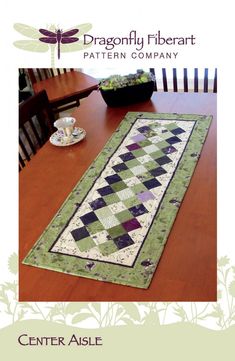 the table runner is on top of a wooden table with a cup and saucer