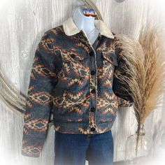 Charcoal Aztec Sherpa Jacket Western Jacket Product Details - Matte black buttons - Hits right at waist - Super warm - Colors: charcoal, blue, mustard, burnt orange - Fits true to size ~ XS 0-2 ~ Small 2-4 ~ Medium 6-8 ~ Large 10-12 ~ XL 14-16 ~ XXL 18-20 Material & Care - Shell: 70% Polyester / 20% Acrylic / 10% Viscose - Lining: 100 Polyester 100% Acrylic - Dry clean only Cactus Western, Charcoal Blue, Orange Fits, Western Boutique, Western Jacket, Western Women, Outwear Women, Sherpa Jacket, Sell Out