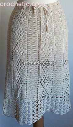 a white crocheted skirt on a mannequin