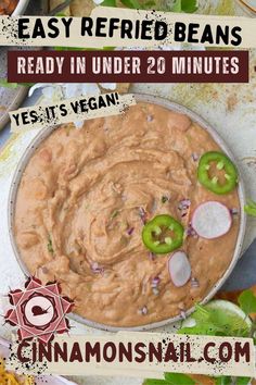 an image of a bowl of food with the words easy refried beans ready in under 20 minutes yes it's vegan