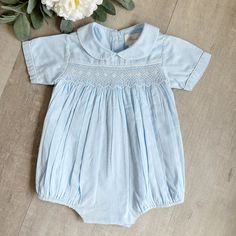 This Strasburg Romper For Little Boy's Is A Classic!! This Style Is Rare And A Great Find!! No Longer In Production And In Perfect Condition. The Romper Is Done In A 100% Cotton Lawn And Is Fully Lined. The Peter Pan Collar Is Trimmed In A Contrasting Piping, Giving A Tailored Look. The Chest Has A Smocked Panel Done In White Embroidery And Is Bordered On Top With A Matching Piping. The Majority Of The Smocking Is Done In A Small Lattice Design. Within The Lattice Work Is A Row Done In An Argyle Cotton Smocked Dress With Short Sleeves For Playtime, Light Blue Fitted Smocked Cotton Dress, Fitted Light Blue Smocked Cotton Dress, Light Blue Fitted Cotton Smocked Dress, Blue Cotton Smocked Playtime Dress, Light Blue Cotton Smocked Dress, Boys Smock, Boys Overalls, Spring Rompers