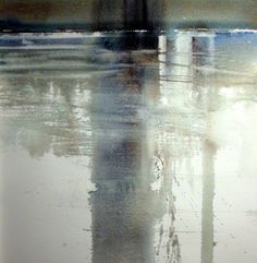 the reflection of a clock tower is shown in the wet surface of the water and it's reflections