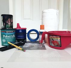 the supplies needed to make an art project are sitting on top of a white table