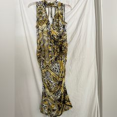 This Beautiful Venus Dress Features A Stylish Paisley Pattern In Shades Of Yellow And Gray. The Dress Has A High Neckline And Sleeveless Design, Making It Perfect For Both Casual And Party Occasions. It's Made Of A Comfortable Polyester Material With A Touch Of Elastane For Added Stretch. The Dress Has A Bodycon Style And Falls To A Midi Length. It's A Regular Size M And Is Suitable For The Summer, Fall, And Spring Seasons. This Dress Is Brand New Without Tags And Sure To Make A Statement At Any Yellow Stretch V-neck Maxi Dress, Yellow Stretch Maxi Dress With V-neck, Yellow Ruched Midi Dress For Beach, Yellow Ruched V-neck Midi Dress, Yellow Sleeveless Ruched Midi Dress, Yellow Ruched Sleeveless Midi Dress, Yellow Ruched Maxi Dress For The Beach, Yellow Ruched Maxi Dress For Beach, Yellow Halter Neck Midi Dress