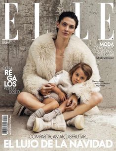 a woman sitting next to a child on top of a magazine cover