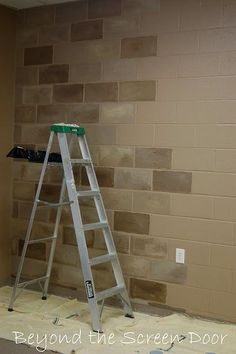 a ladder is in front of a brick wall