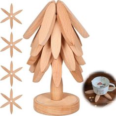 a wooden christmas tree with coffee mugs on it and four pieces of wood in the background