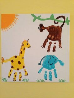 an image of children's handprints on paper with animals in the background