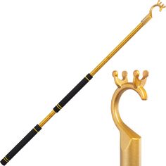 a gold and black cane with a crown on it next to a golden umbrella holder