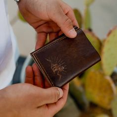 Beautifully made, genuine deer Leather wallets stamped with our Antler Rings Elk logo for an added touch of rustic. Handmade design, and the perfect necessity for any true outdoorsman or huntsman. Available in a traditional Bifold, or Trifold design and plenty of interior pockets for cash, cards, and more! ABOUT THIS ITEM Material: Deer Leather Open Length: 9.5 inches Width: 4.25 inches Elk Logo, Antler Rings, Antler Ring, Father's Day Gifts, Leather Wallets, Gift Accessories, Handmade Design, Antlers, Elk