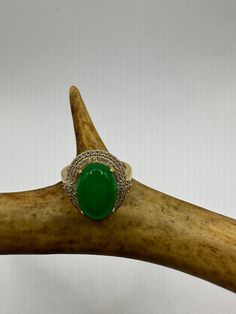 vintage green fun jade ring  Setting is a golden finished bronze setting  This is one of my hand re finished treasures. Salvaged from vintage.  Size   7.5 Re sizing can be done for a $20 fee and may take up to a week.  Engraving is $4 per letter.  Thank you for supporting a veteran's small business. All jewelry is shipped free within the US in a stylish gift box Antique Gold Emerald Ring With Oval Cabochon, Antique Emerald Ring In Gold With Oval Cabochon, Heirloom Green Oval Cabochon Jewelry, Heirloom Oval Green Jewelry, Heirloom Green Oval Jewelry, Green Oval Heirloom Jewelry, Antique Green Oval Cabochon Ring, Vintage Oval Jade Rings, Vintage Green Oval Cabochon Jewelry