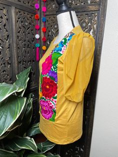 "Trendy Floral Embroidered Blouse - Artisan Made Embroidered Blouse - Chiapas, Mexico Beautiful hand embroidered blouse! This has been made and brought directly from Chiapas, Mexico. The blouse has extremely detailed embroidery. The embroidery is 100% handcrafted. All the work on this blouse has a professional skilled finish and the multicolor embroidered makes it look even more eye catching. The embroidery work is made with great quality thread. The eye catching will be on the embroidered work, Traditional Festive Tops With Embroidered Sleeves, Traditional Tops With Embroidered Sleeves For Festive Season, Fitted Traditional Top With Embroidered Sleeves, Festive Traditional Tops With Embroidered Sleeves, Traditional Festive Top With Embroidered Neckline, Bohemian Yellow Blouse With Floral Embroidery, Traditional Yellow Embroidered Blouse, Bohemian Tops With Embroidered Sleeves For Festive Occasion, Festive Short Sleeve Top With Floral Embroidery