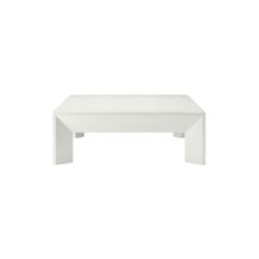 a white coffee table sitting on top of a white floor