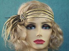 "Gold 1920s headband, Gatsby headband, 1920s headpiece, Black and Gold 1920s headband, Flapper headband, 1920s hair accessory, 1920s This stunning 1920's Vintage Inspired Gatsby headband is the perfect accompaniment for any 1920s styled event. I've designed and created this one of a kind headband so feminine and romantic. Made with three rows of Gold textured Satin elastic accompanied by Black and Antique Gold Ostrich feathers. The headband measures 21 1/2\" not stretched. I only use cruelty-fre Great Gatsby Accessories, 1920s Hair Accessories, Gatsby Accessories, Flapper Hair, 1920s Headband, Gatsby Headpiece, Flapper Headpiece, Gatsby Headband, 1920s Headpiece