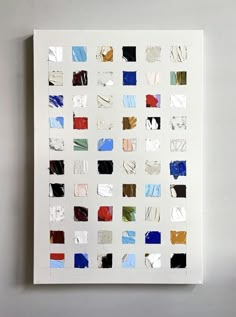 a piece of art that looks like it is made out of different colored paper squares