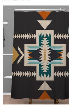 the shower curtain is decorated with an native style design and has arrows on it's side