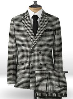 In black and white, the double breasted tweed suit boasts a heritage inspired houndstooth check design for a modern take on a menswear classic. Wear this statement-making design with a white crew-neck t-shirt and black boots for a novel take on a tailored look. 
 
 Look Includes  Big BW Houndstooth Tweed Fabric  Double Breasted Jacket Style  Peak Lapel  Horn Royal Black Buttons  Single Vent  Three Cuff Buttons  Two welted back pockets on trousers   You can change the look during customization if Tailored Tweed Blazer With Houndstooth Pattern, Tweed Houndstooth Blazer With Notch Lapel, Tailored Tweed Sport Coat With Houndstooth Pattern, Tailored Houndstooth Tweed Jacket For Business, Business Tweed Sport Coat With Houndstooth Pattern, Business Tweed Houndstooth Sport Coat, Business Tweed Jacket With Houndstooth Pattern And Suit Collar, Double-breasted Houndstooth Blazer, Elegant Double-breasted Houndstooth Tweed Jacket