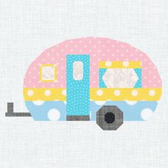 a pink and blue trailer with polka dots on it's side is shown in the shape of an rv