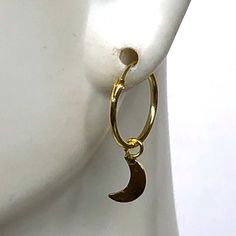 A PAIR of sterling silver hoops dipped in gold. Comes with a tiny crescent moon charm. The charm is multipurpose and can be used with a neck or bracelet chain too. Dimension: Hoop- 12x1 mm Charm- 4 x 9mm Drop length- 18 mm This piece is made of 925 hypoallergenic sterling silver. All my pieces are sent in a gift box. I can include a personal message from you if needed. You are welcome to contact me at... bhavnakwintra1956@gmail.com More hoops: https://www.etsy.com/your/shops/TheSilverGame/tools/ Adjustable Nickel-free Celestial Hoop Earrings, Moon Charm Hoop Earrings In Celestial Style, Celestial Small Hoop Nickel-free Jewelry, Celestial Style Small Hoop Nickel-free Jewelry, Gold Half Moon Hoop Earrings With Moon Charm, Brass Hoop Earrings With Moon Charm As A Gift, Celestial Hoop Earrings With Moon Charm, Celestial Round Hoop Earrings With Moon Charm, Gold Celestial Hoop Earrings With Moon Charm