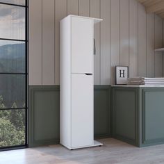 a tall white refrigerator freezer sitting inside of a kitchen