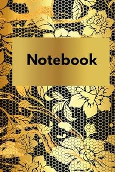 a notebook with gold flowers on it and the words notebook written in black ink,