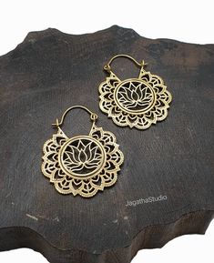 HANDMADE Stunning Boho Mandala Earrings, with a lotus in the interior of the piece. The lotus is the symbol of what is divine or immortality in humanity, and is also a symbol of divine perfection. A symbol of purity, enlightenment, self-regeneration and rebirth. It symbolizes the realization of inner potential and in Tantric and Yogic traditions the lotus symbolizes the potential of an individual to harness the flow of energy moving through the chakras. Ideal for every day wear, or for a special Sacred Jewelry, Sacred Lotus, Mandala Earrings, Boho Mandala, Les Chakras, Earrings Bohemian, Jewelry Earrings Hoops, Alex And Ani Charm Bracelet, Jewelry Inspiration