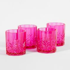 three pink glasses sitting next to each other