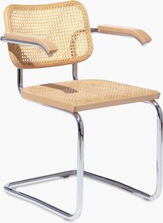 a chair that is made out of wicker and metal frame with a wooden seat