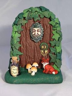 a gnome's door with mushrooms and leaves surrounding it