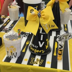 the table is decorated with yellow and black decorations