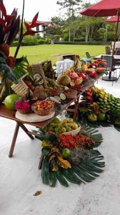 a table filled with lots of different types of fruits and veggies on it