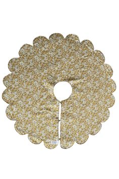 a gold and white flower shaped cake plate on a white background with the edge cut out