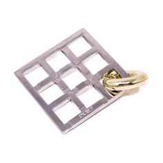 a gold and silver square ring on a white background with the word love written in it