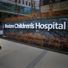 a sign for boston children's hospital on the side of a building