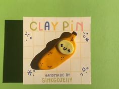 a close up of a piece of paper with a cartoon character on it and the words clay pin