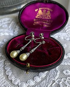 Featuring a beautiful antique pair of Edwardian Belle Époque 1910s 830  silver Austra, Germany  screw back drop earrings adorned with luminous glass Majorca peals accented brilliant sparkling closed back Marcasite crystals.  Earrings are in excellent antique condition with functional backings, minimal wear with all stones intact and accounted for.  Measuring approximately 1.5 inches long at 3.15  grams respectively and are stamped 830 on the clasps .  These are absolutely gorgeous, ready to wear Vintage Round Pearl Drop Jewelry, Vintage Hallmarked Dangle Earrings, Art Deco Formal Earrings Hallmarked, Vintage Formal Pearl Drop Earrings, Vintage Pearl Drop Earrings For Formal Occasions, Vintage Round Pearl Drop Earrings, Vintage Drop Earrings With Matching Set, Vintage Drop Earrings For Pierced Ears, Vintage Drop Jewelry Set With Matching Earrings