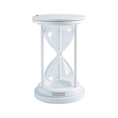 an hourglass is sitting on top of a white stand with the word time in it